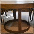 F48. Lillian August "Grant" round metal edge table. 30"h x 60" 